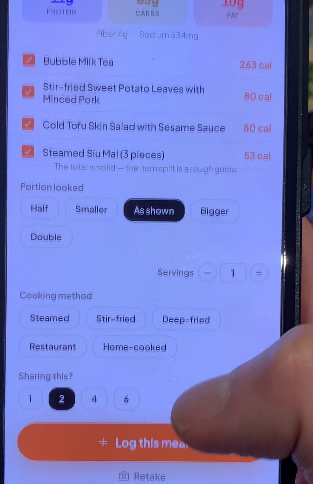 Bao's result screen after setting the table to share between 2 people, listing halved rows: Bubble Milk Tea 263 cal, Stir-fried Sweet Potato Leaves with Minced Pork 80 cal, Cold Tofu Skin Salad with Sesame Sauce 80 cal, Steamed Siu Mai 53 cal