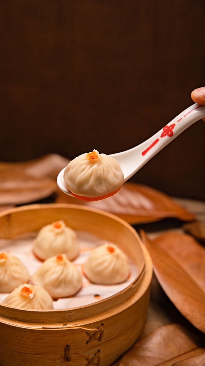 A steamer basket of xiao long bao soup dumplings